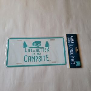 Camco brand metal camping theme license plate
